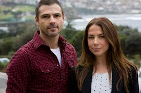 Jonny Pasvolsky and Carolyn posing for a photoshoot